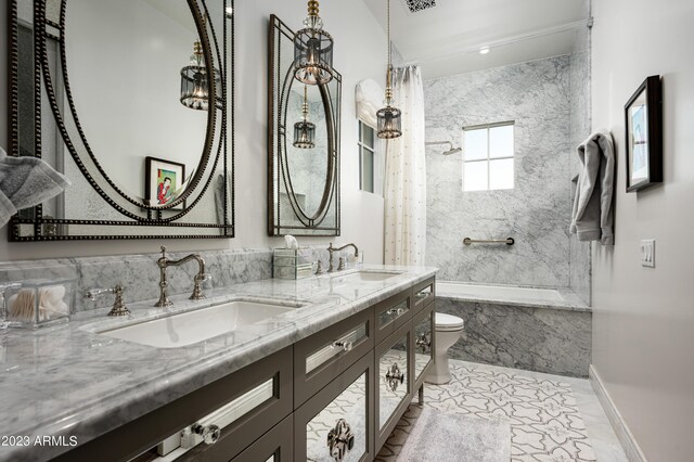 full bathroom with shower / bathtub combination with curtain, vanity, and toilet