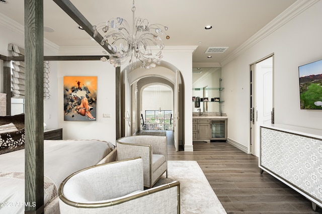 interior space featuring ornamental molding, dark hardwood / wood-style floors, a chandelier, and beverage cooler