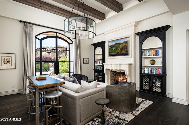 living room featuring a notable chandelier, beamed ceiling, and dark hardwood / wood-style floors