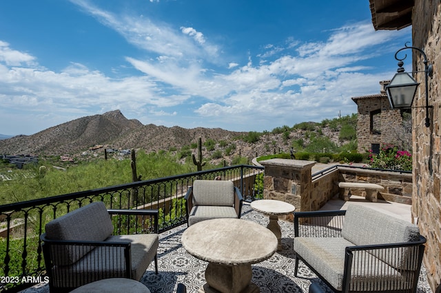 view of patio / terrace featuring a mountain view