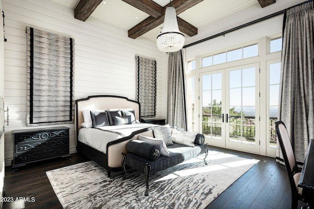 bedroom featuring multiple windows, beamed ceiling, access to exterior, and dark wood-type flooring