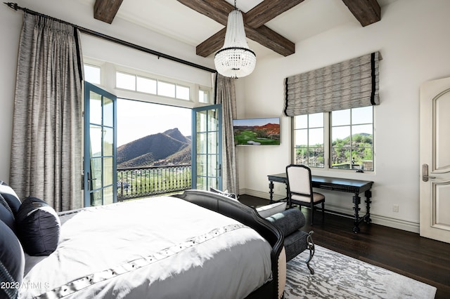 bedroom with a notable chandelier, beamed ceiling, and dark wood-type flooring