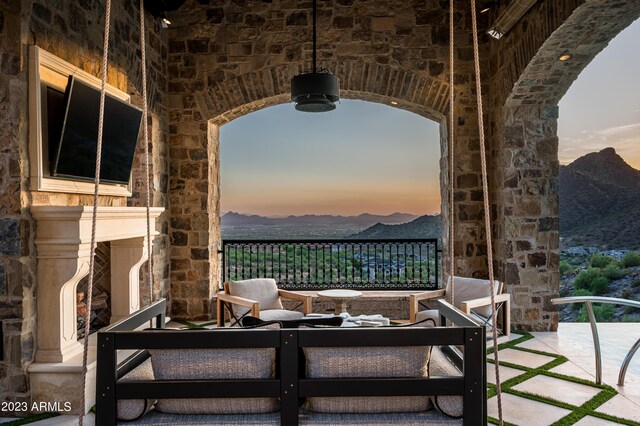 view of patio / terrace with a mountain view and an outdoor hangout area