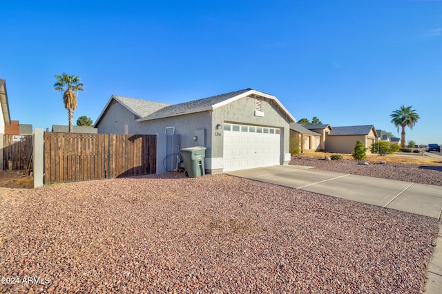 single story home featuring a garage