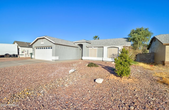 ranch-style home featuring a garage