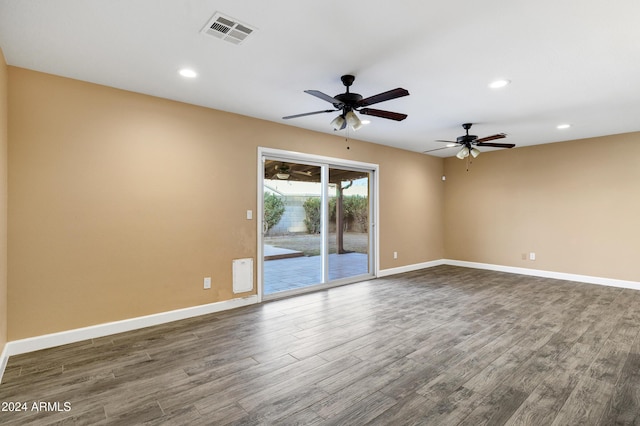 spare room with dark hardwood / wood-style flooring