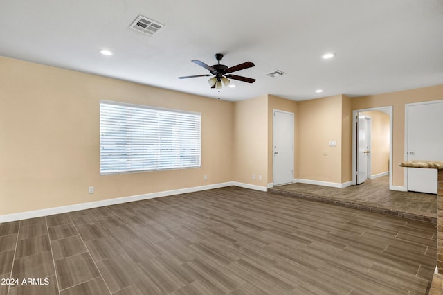 empty room featuring hardwood / wood-style flooring and ceiling fan