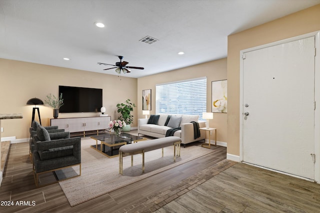 living room with ceiling fan and wood-type flooring