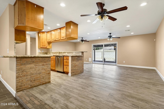 kitchen with ceiling fan, dishwasher, sink, light hardwood / wood-style flooring, and kitchen peninsula