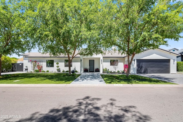 3710 E Hazelwood St, Phoenix, AZ 85018 - ranch-style house with a garage, stucco siding, a front yard, and concrete driveway