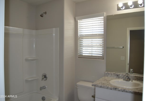 full bathroom featuring shower / bathing tub combination, vanity, plenty of natural light, and toilet