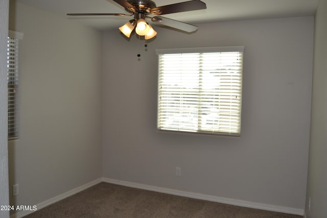 carpeted empty room with ceiling fan