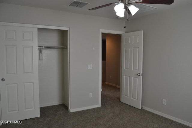 unfurnished bedroom with ceiling fan, carpet flooring, and a closet