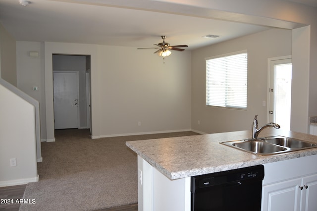 kitchen with dishwasher, ceiling fan, sink, carpet floors, and white cabinetry