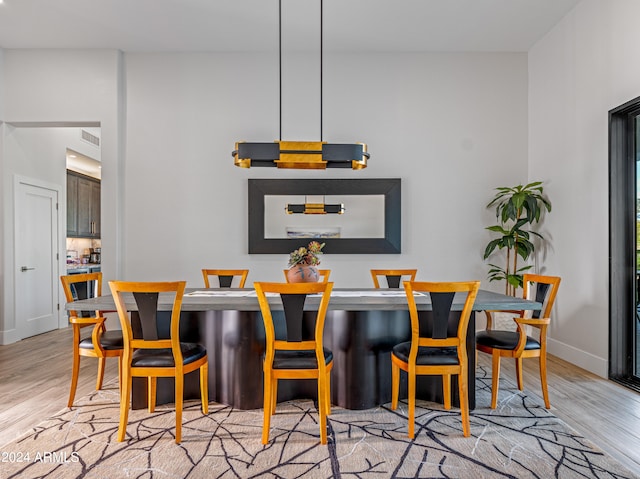 dining area featuring light wood-type flooring