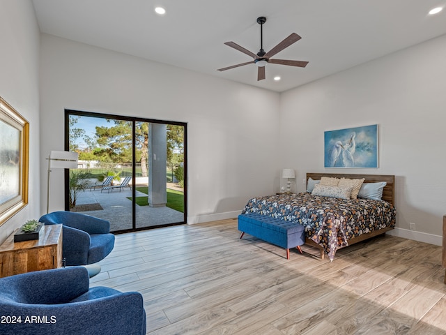 bedroom featuring ceiling fan, light wood-type flooring, and access to exterior