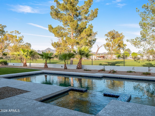 view of swimming pool featuring a mountain view