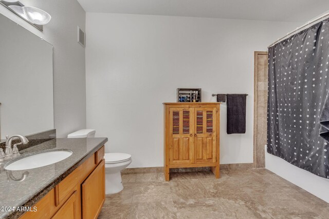 bathroom with visible vents, toilet, vanity, and a shower with curtain