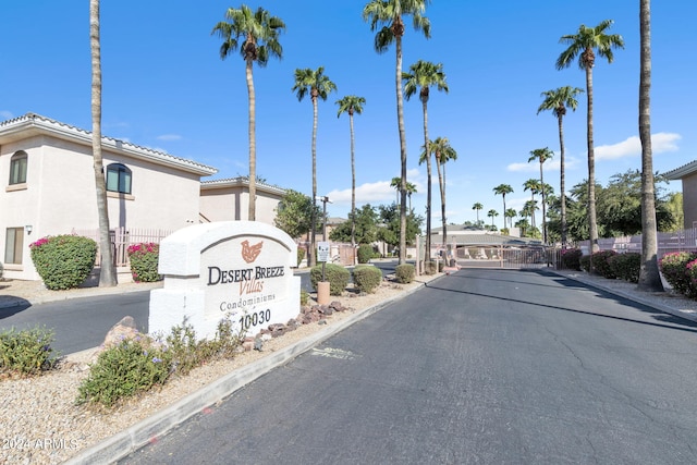 10030 W Indian School Rd Unit 218, Phoenix, AZ 85037 - view of asphalt road featuring a gated entry and curbs
