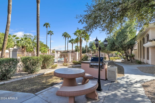 10030 W Indian School Rd Unit 218, Phoenix, AZ 85037 - view of patio with exterior kitchen