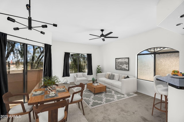 10030 W Indian School Rd Unit 218, Phoenix, AZ 85037 - carpeted living area featuring ceiling fan and a chandelier