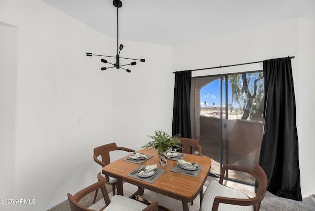 10030 W Indian School Rd Unit 218, Phoenix, AZ 85037 - dining room featuring a chandelier and carpet