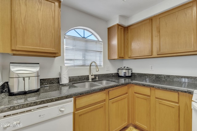 10030 W Indian School Rd Unit 218, Phoenix, AZ 85037 - kitchen featuring white dishwasher and dark stone countertops