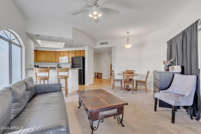 living room featuring visible vents, recessed lighting, baseboards, light colored carpet, and ceiling fan