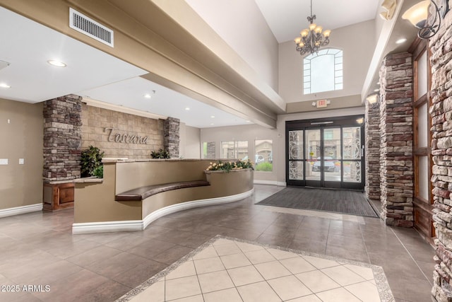 reception area with a chandelier and recessed lighting