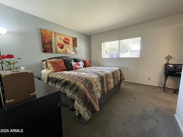 bedroom with carpet and baseboards
