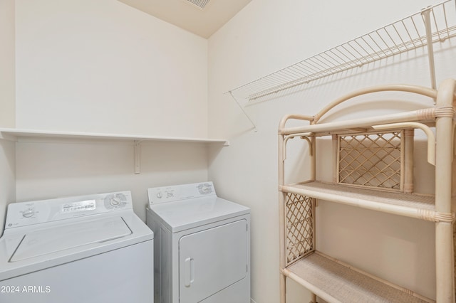 washroom featuring washing machine and dryer