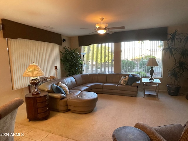 tiled living room with ceiling fan