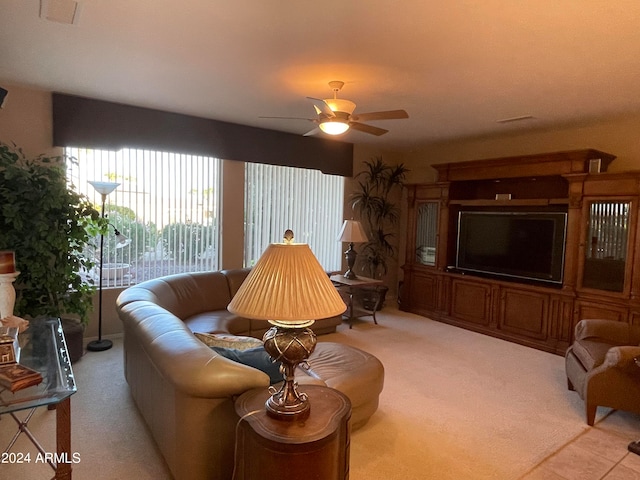 living room featuring light carpet and ceiling fan