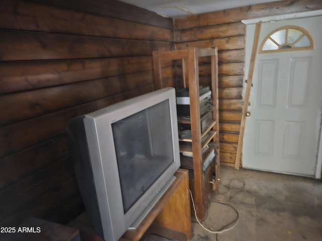 foyer with rustic walls