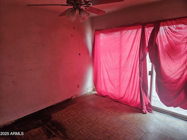 unfurnished room featuring parquet flooring and ceiling fan