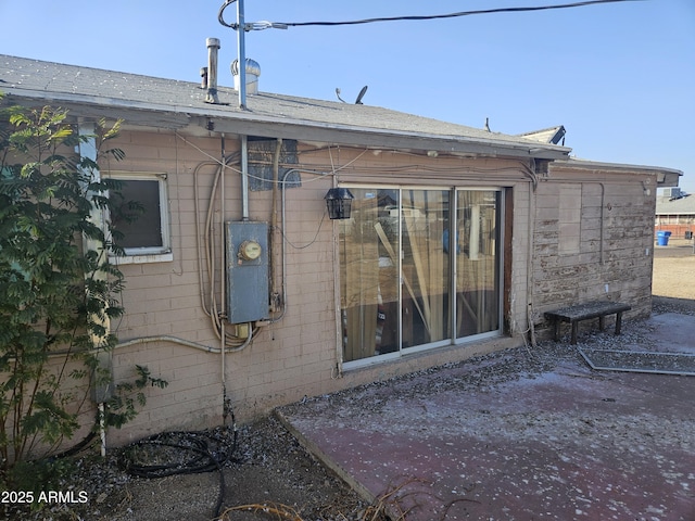 view of property exterior with a patio