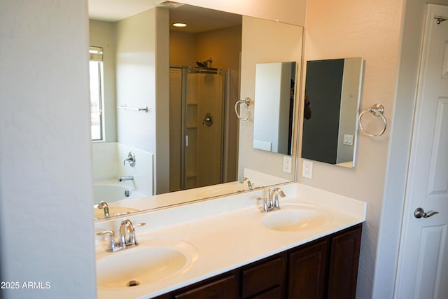 bathroom with vanity and independent shower and bath