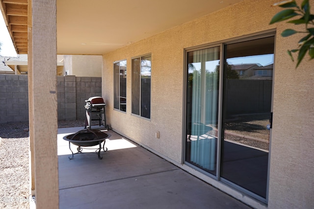 view of patio / terrace with a fire pit