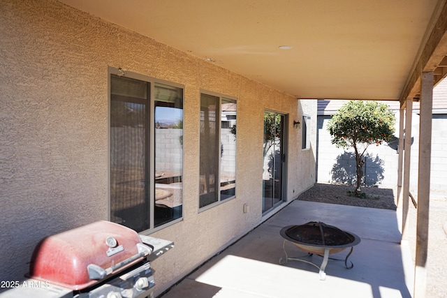 view of patio featuring grilling area and an outdoor fire pit