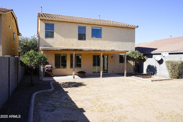 rear view of house featuring a patio area