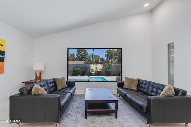 living room with high vaulted ceiling