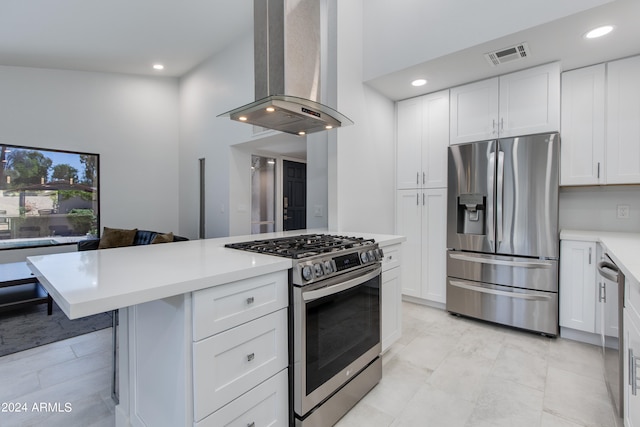 kitchen featuring white cabinets, stainless steel appliances, and island exhaust hood