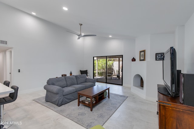 living room featuring high vaulted ceiling and ceiling fan