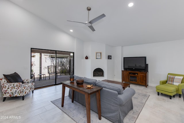 living room featuring high vaulted ceiling and ceiling fan