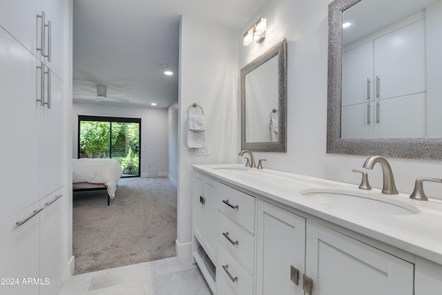 bathroom featuring ceiling fan and vanity