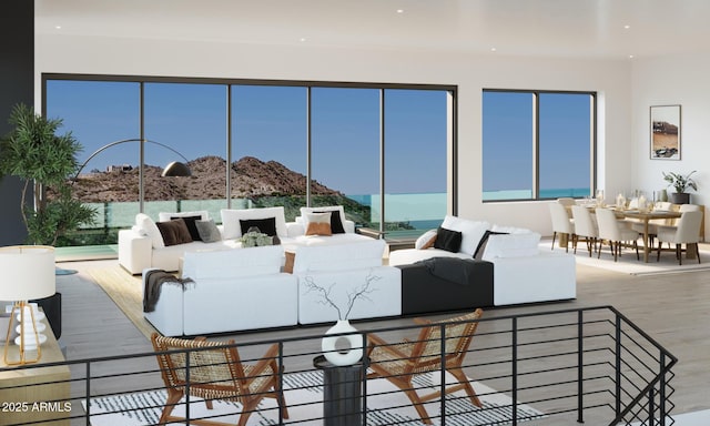 living room featuring a mountain view and hardwood / wood-style floors