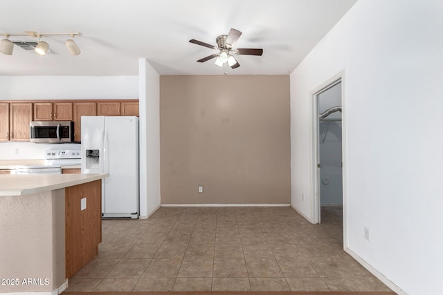 kitchen featuring ceiling fan, white appliances, and light tile patterned flooring