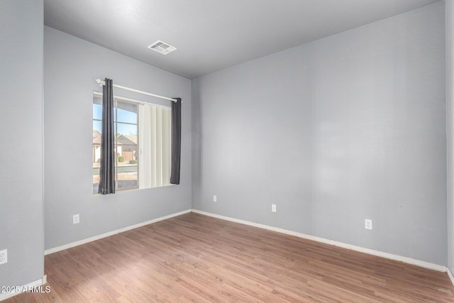 unfurnished room featuring wood-type flooring