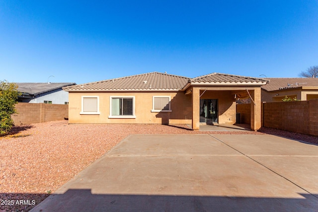 rear view of property featuring a patio area