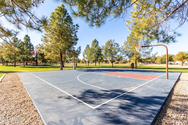 view of basketball court featuring a lawn